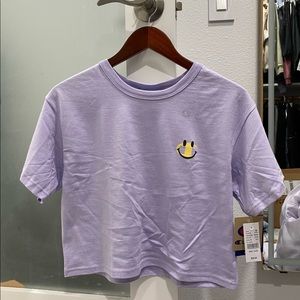 PacSun Champion smiley face cropped tee in light purple lavender color